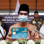 alt_text: "Peluncuran Kartu Huma Betang untuk kesejahteraan sosial di Kalimantan Tengah."