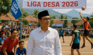 alt_text: Pemuda desa bersemangat bertanding voli di Liga Desa 2026 Garut, mengobarkan semangat persatuan.
